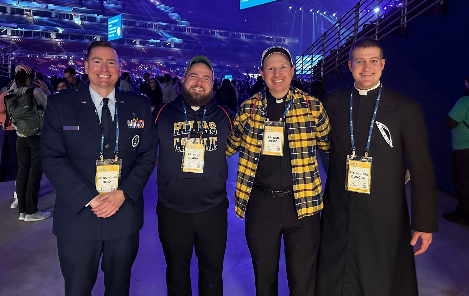 Father Nicholas Reid, a priest of the diocese who’s serving as an Air Force chaplain in San Antonio, Texas; Father Paul Clark, chaplain of Helias Catholic High School and diocesan vocation director, director of seminarians and moderator of youth and young adult ministry; Father Daniel Merz, pastor of St. Thomas More Newman Center Parish in Columbia; and Father Joshua Duncan, pastor of St. Mary Parish in Glasgow and St. Joseph Parish in Fayette gather for a photo at the SEEK23 conference in St. Louis.